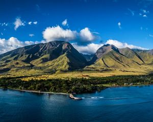 Landscape view of a large mountain range near the coast of the Hawaiian island of Maui.