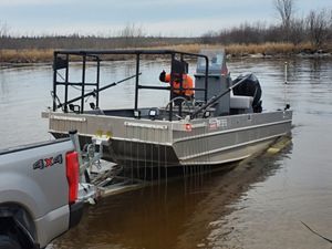 A boat launched into a river. 