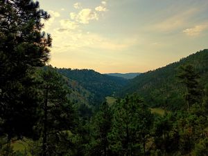 Sun sets over a canyon.