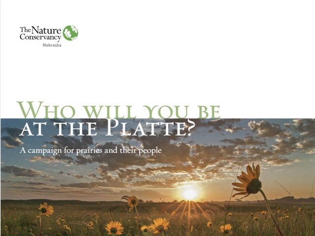 Cover of the campaign brochure showing the sun setting over a wide prairie.