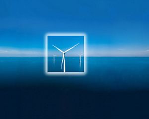 A wind turbine sits in the middle of  a blue ocean with a white square frame around its body.