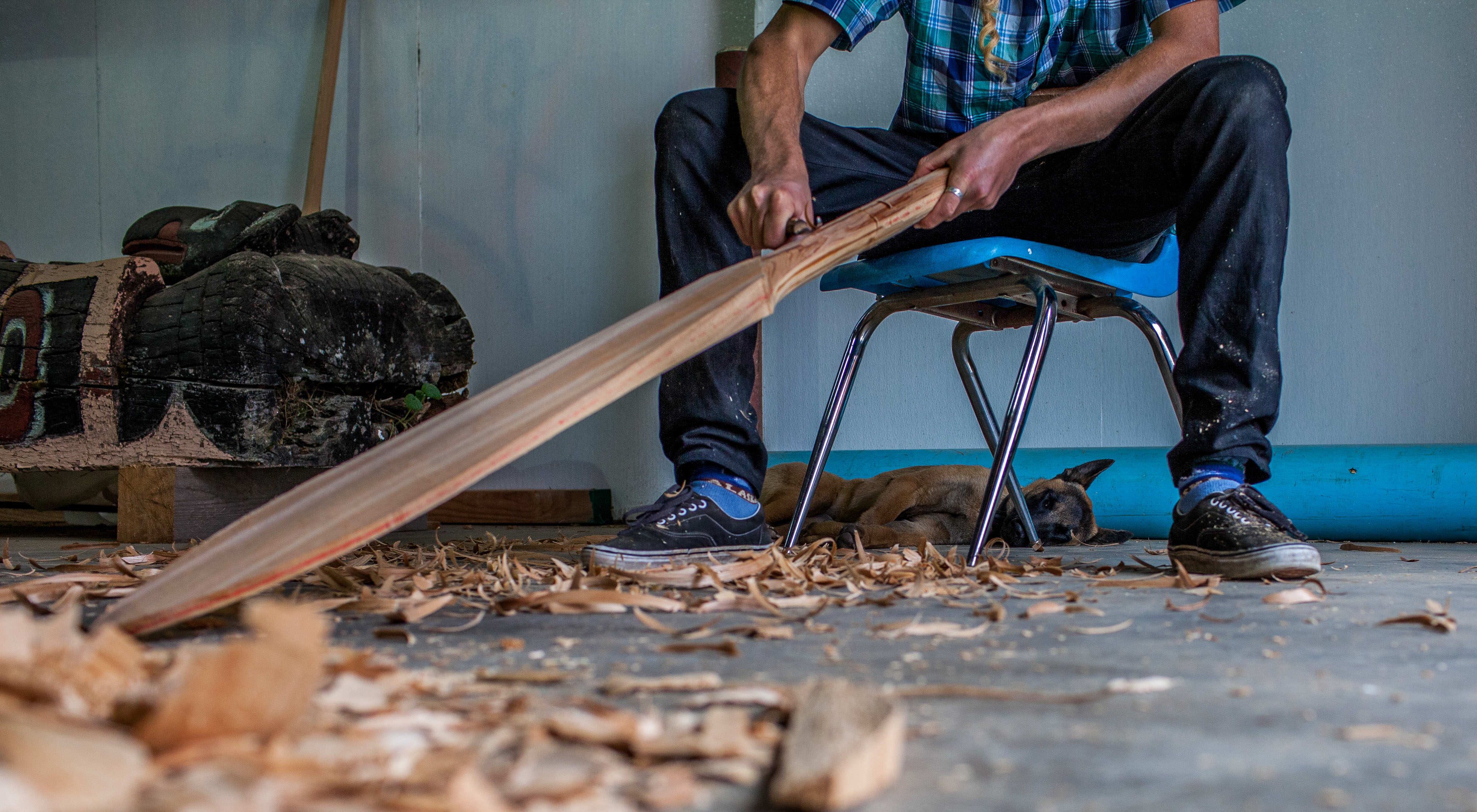 Carving a canoe paddle by hand