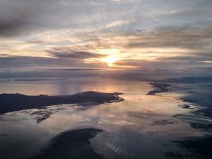Aerial view of the Great Salt Lake in dim sunset light.