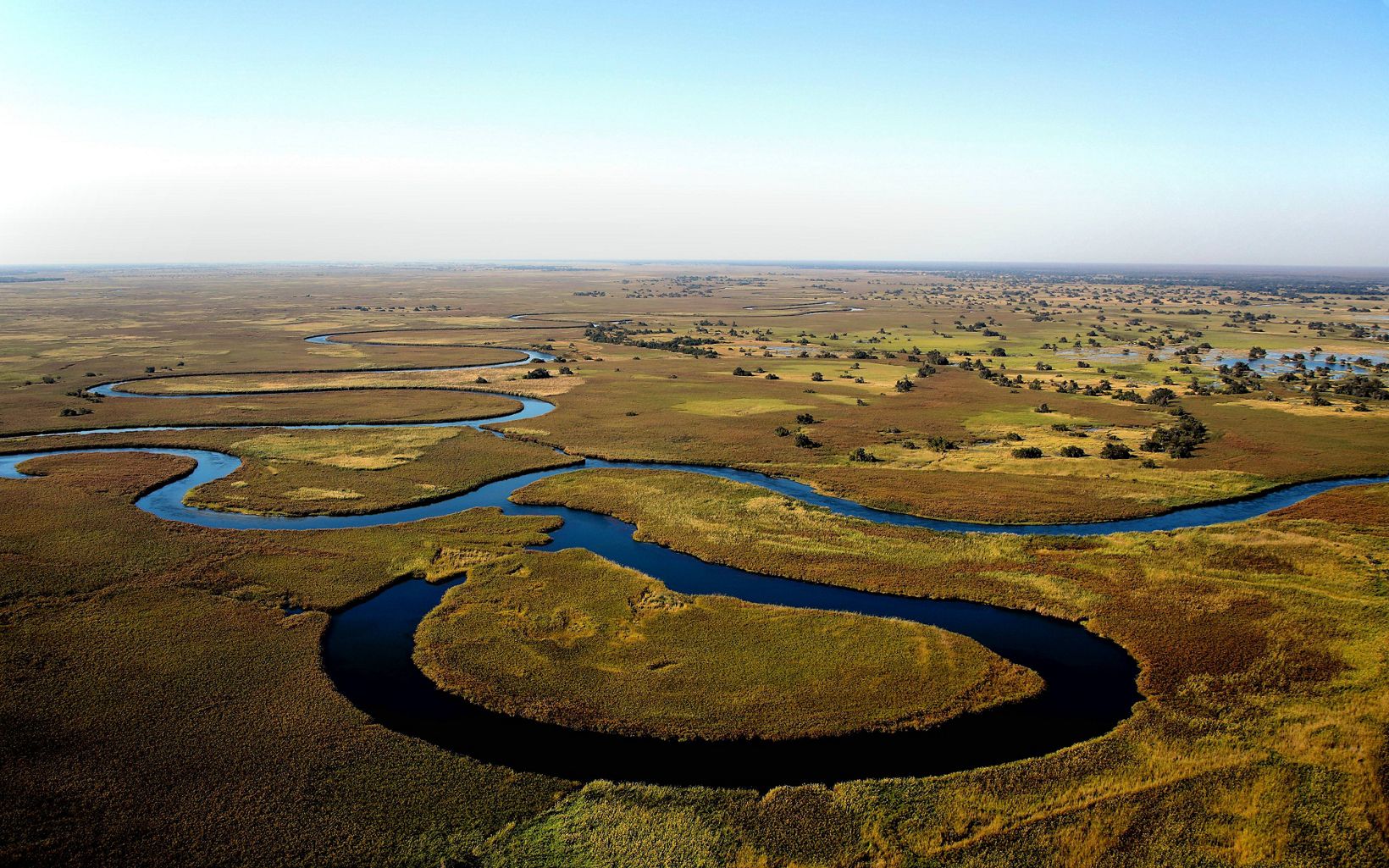 
                
                  Okavango Basin  Africa's latest source water protection project involves adapting TNC's water fund model to conserve the headwaters of the Okavango Basin.
                  © Wynand Uys/Unsplash
                
              