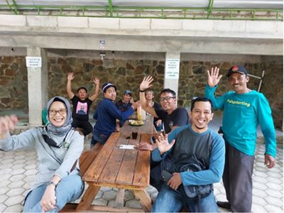 YKAN colleagues rested with some farmers from Rahtawu Village after visiting the rehabilitation area planted by the community.