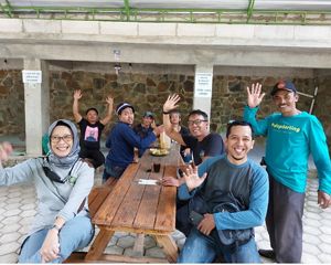 YKAN colleagues rested with some farmers from Rahtawu Village after visiting the rehabilitation area planted by the community.