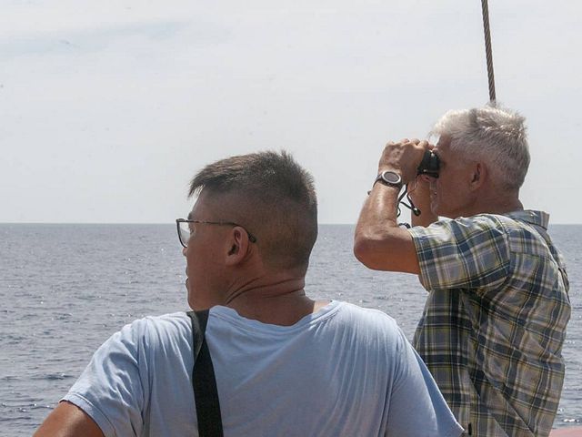 The author of this article with colleague Nandana Godjali (left), Peter Mous wearing binoculars (right) onboard Seven Seas, counting FADs.