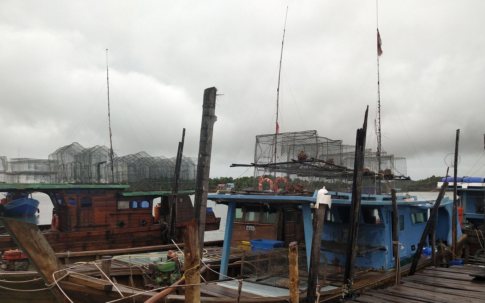 Pier on Bintan Island fishing boats on Bintan Island. © YKAN