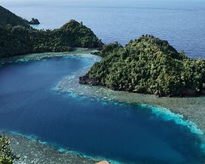 Salt water lake flanked by three large islands on the left and right, with a small island in the middle.