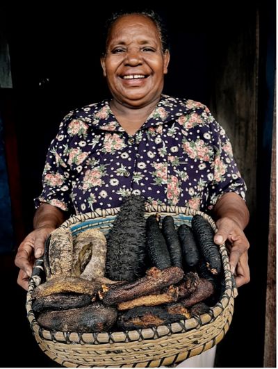 The head of the Waifuna Women's Group, Almina Kacili, brings sea cucumbers that have been processed and are ready to be sold. 